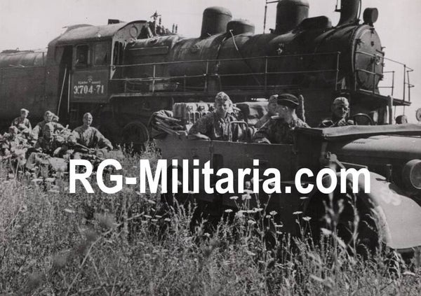 Original WW2 German Waffen SS Press Photo - Waffen SS Vorausabteilung driving next to a Soviet train