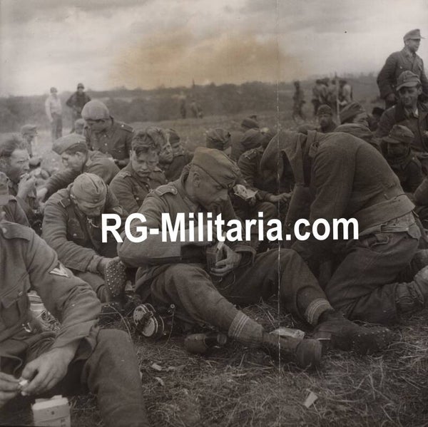 Original WW2 British Press Photo - German POW soldiers eating their rations, Normandy, France (1944)