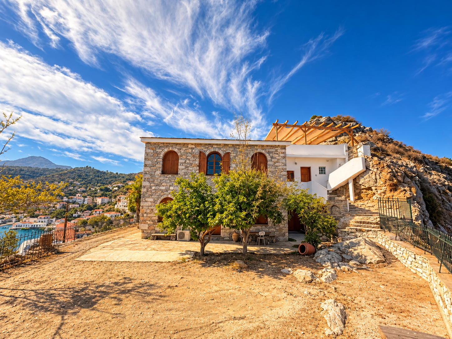Kofinas Villa exterior, stone manor in Evdilos with Aegean sea view