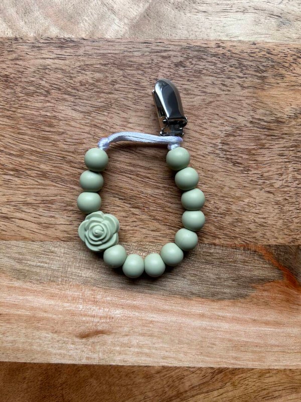 Tuttinauha, ruusu, oliivi