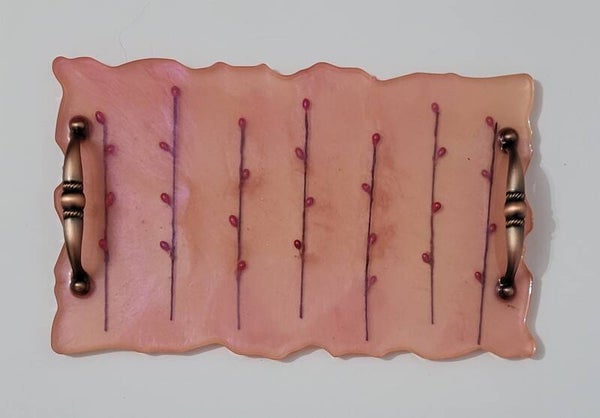 Plateau rose avec bourgeons de fleurs