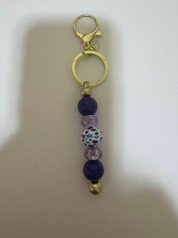 Small Gold-Colored Keychain with Purple & White Beaded Charms – Birds & Flowers