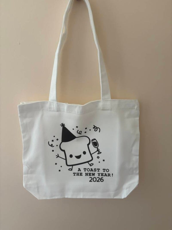 “Here’s a Toast Tote Bag – Celebrate 2026 with Style”