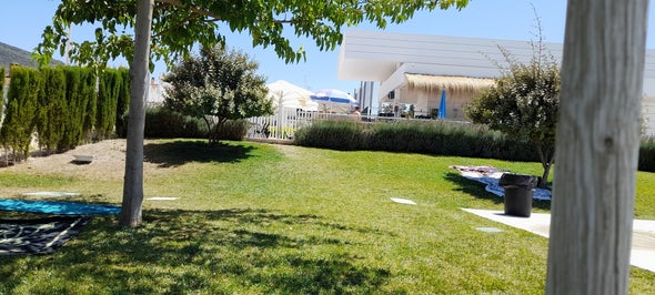 Community swimming pool gardens showing bar and seating area