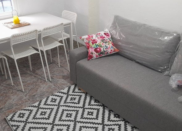 Double sofa bed dining work area in basement