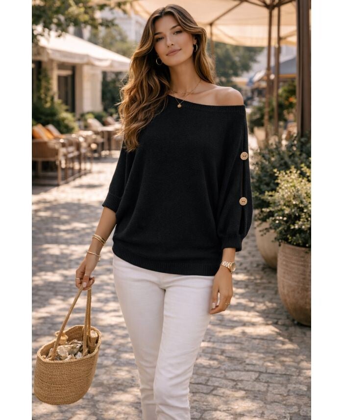 Trui met knopen aan de mouw