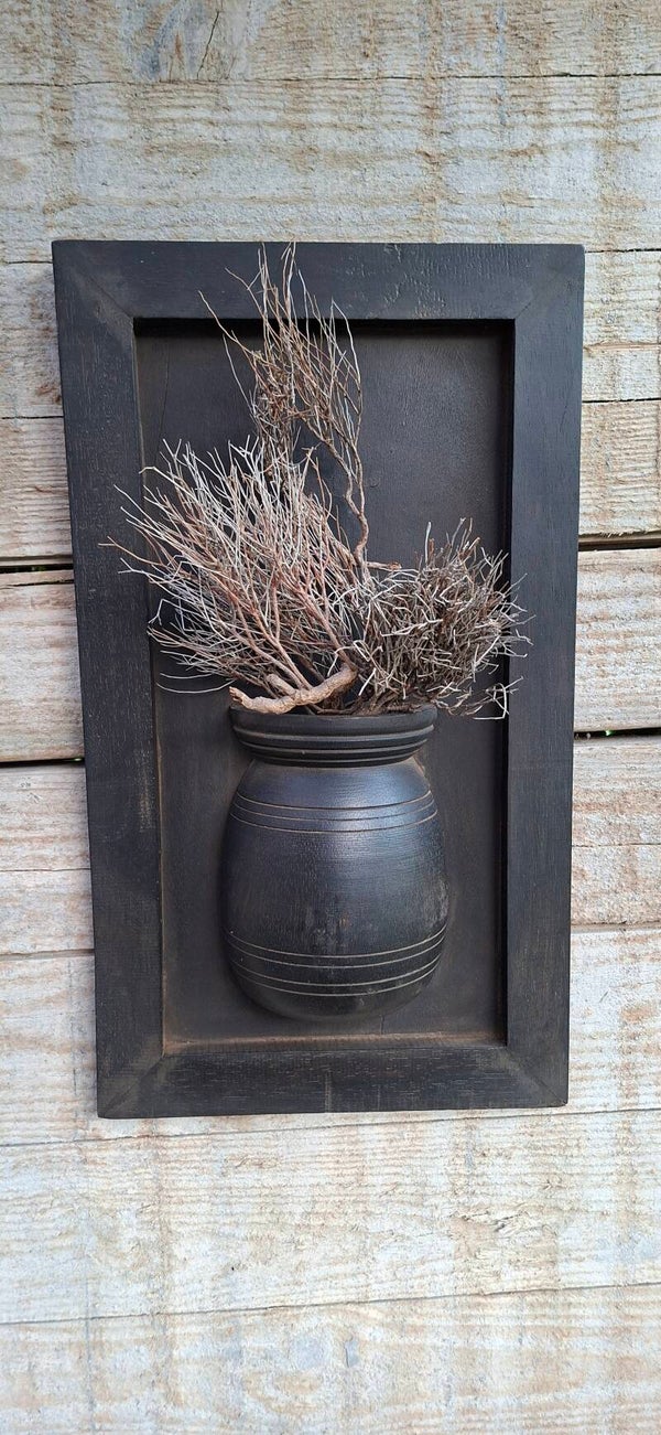 Houten wandpaneel met pot