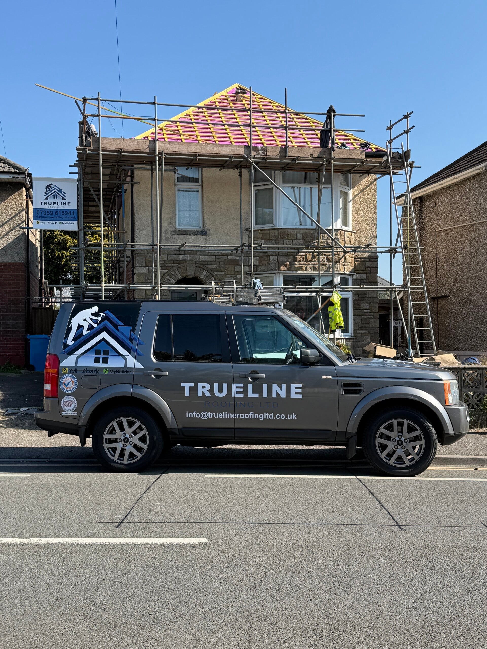 Roof structure covered with purple breathable roofing membrane and timber battens prepared for tile installation