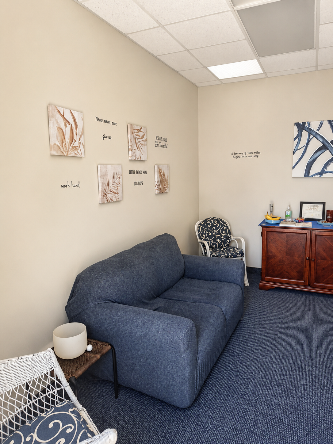 “Licensed massage therapist at Rest and Reset Massage in Greensboro NC consulting with client in a relaxing therapy room”