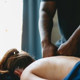 Rest and Reset Massage owner applying deep tissue massage in Greensboro NC