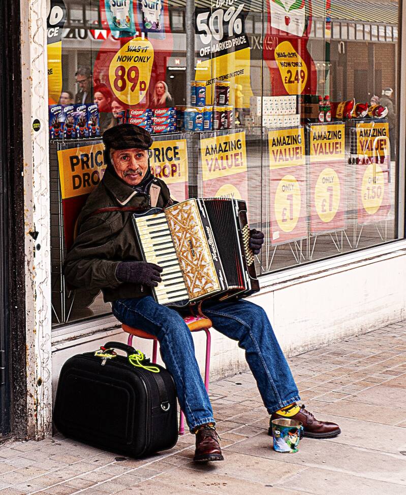 hey-panio-man-play-me-a-tune-busker-birkenhead-shopping-center-standard-32y58x.jpg
