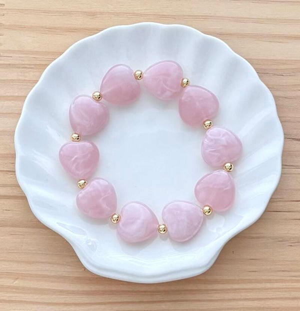 Hartjes armband licht roze