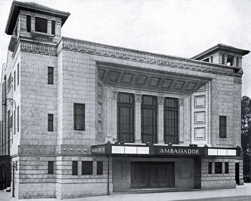 A detailed drawing of the Ambassador Theatre shows its facade, with a marquee and "Café Lounge Ambassador" written above the entrance. People are gathered in front, and a car is parked to the left.