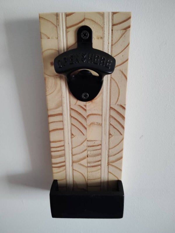 Décapsuleur murale avec récupérateur de capsule