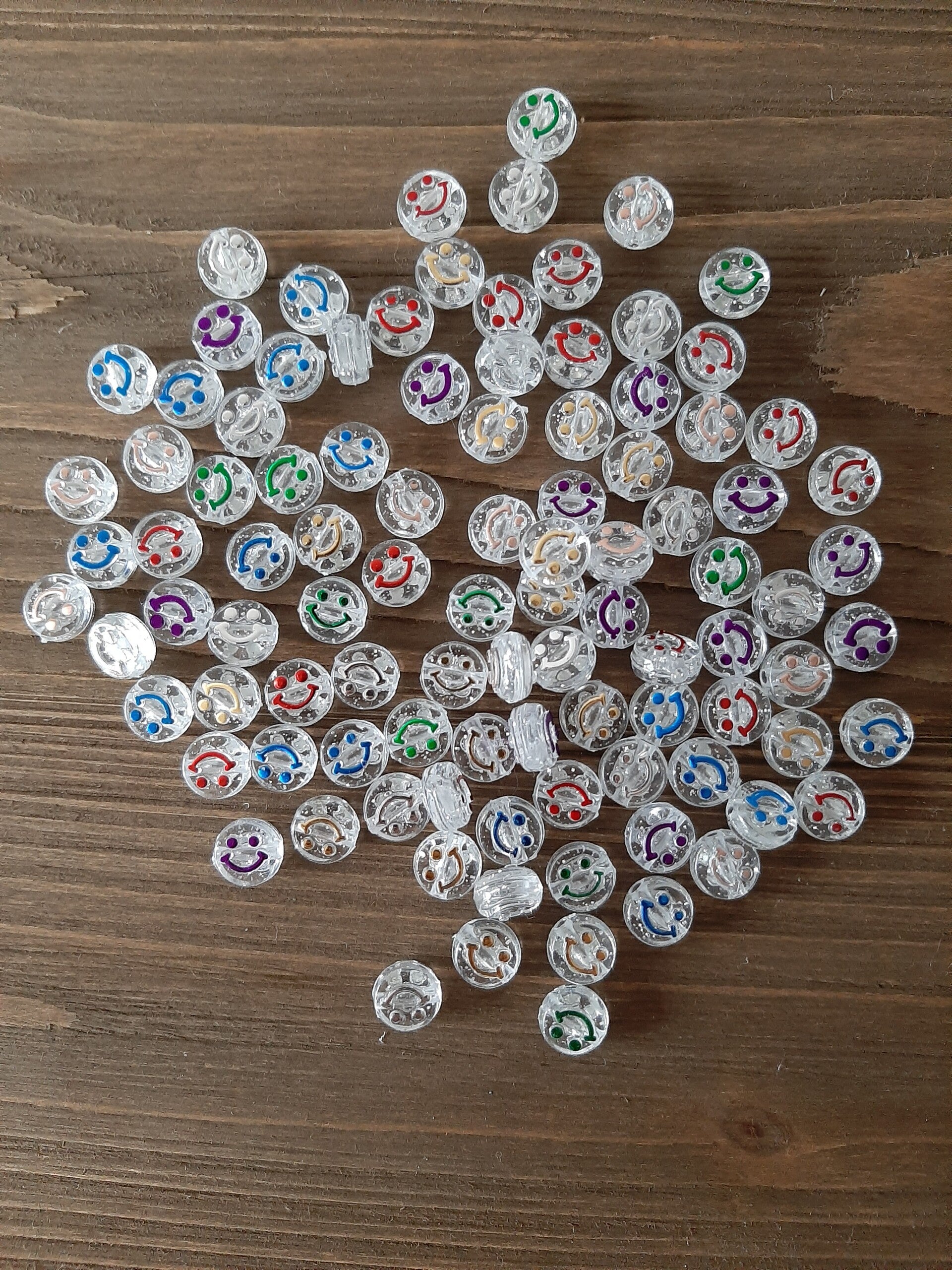 Smiley kralen- doorzichtig/ gekleurd
