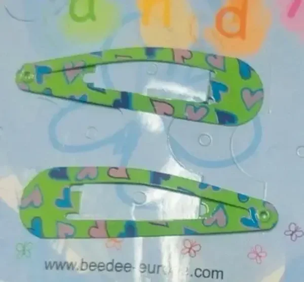 Barrettes pinces clic clac modèle coeurs fond vert