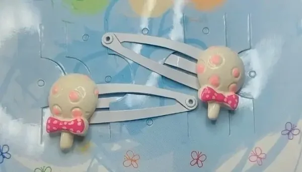 Barrettes pinces clic clac modèle hochet