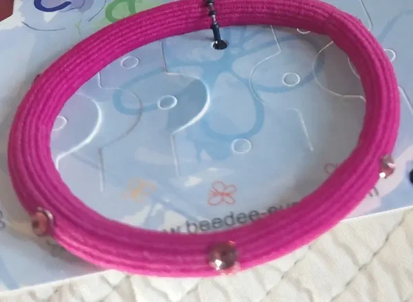 Élastique fuchsia avec strass