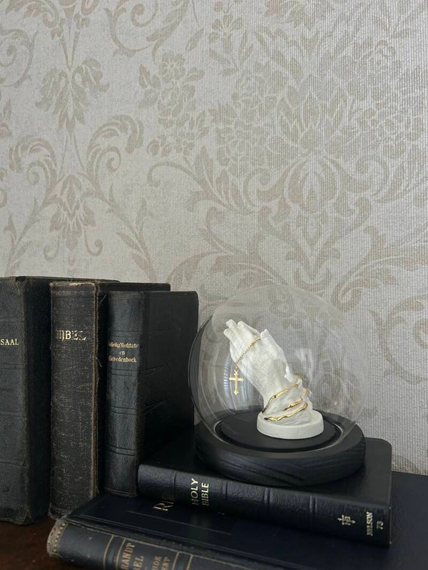 Praying hands in dome