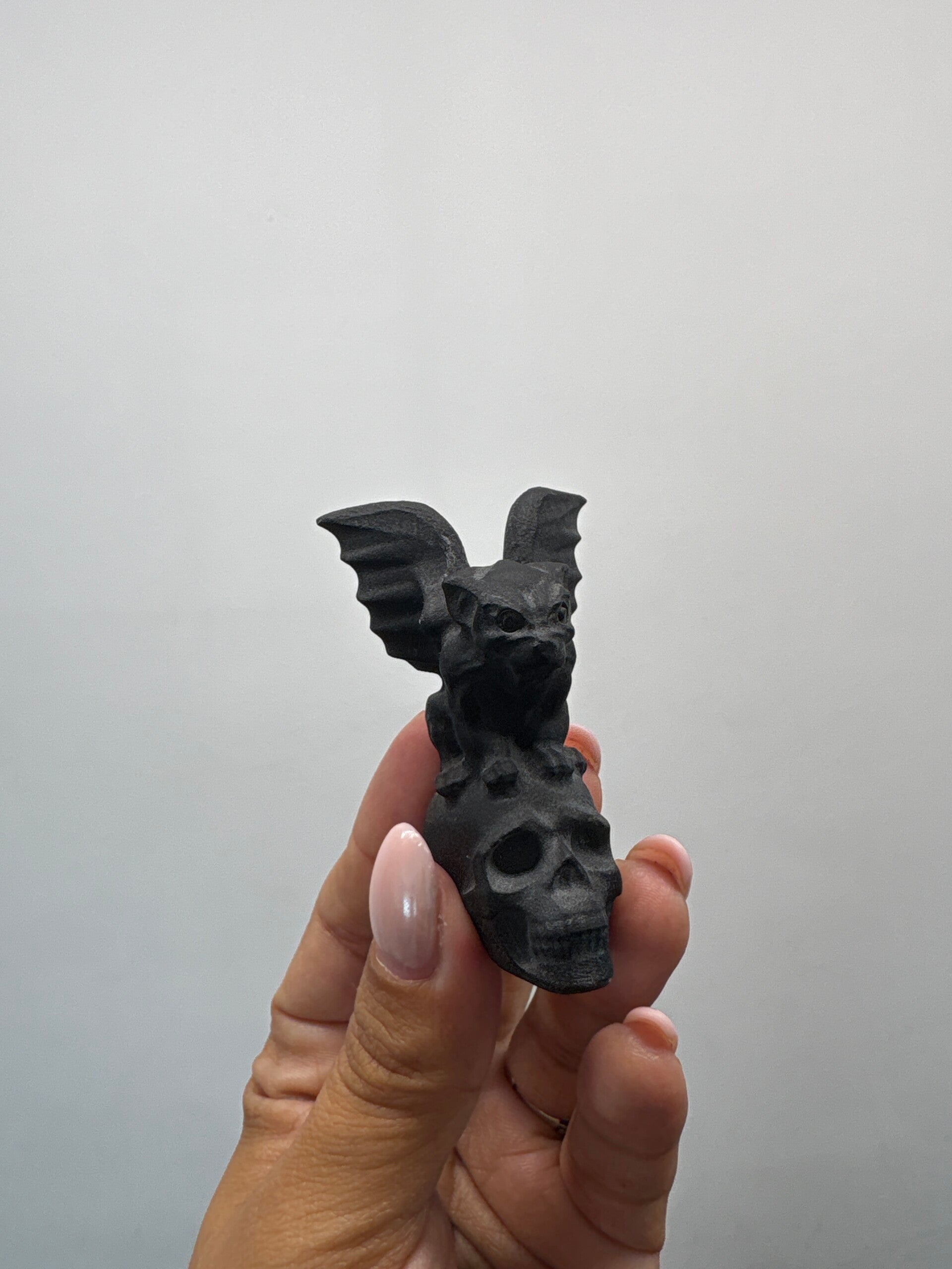 Obsidian Gargoyle on skull Carving