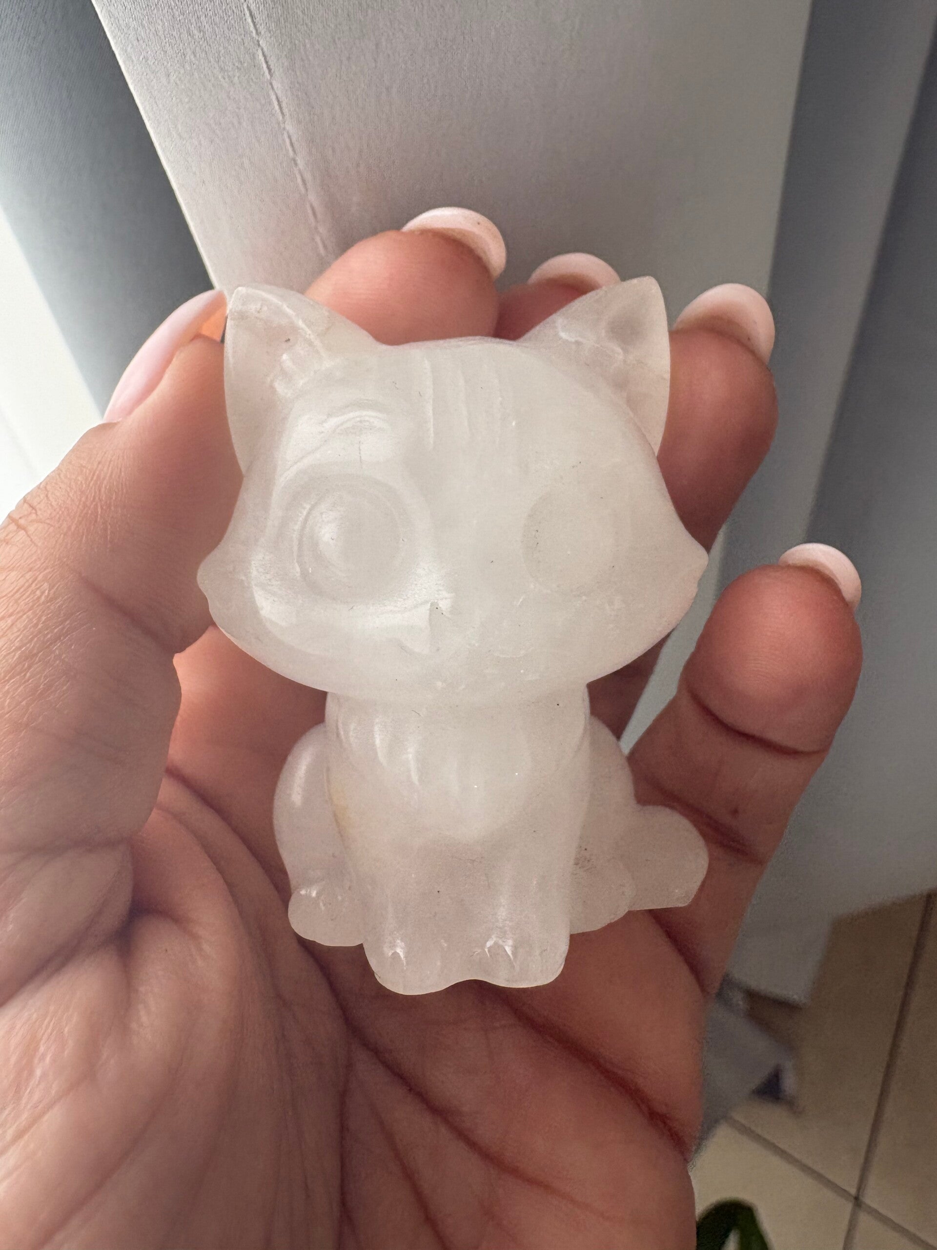 Clear quartz cat carving