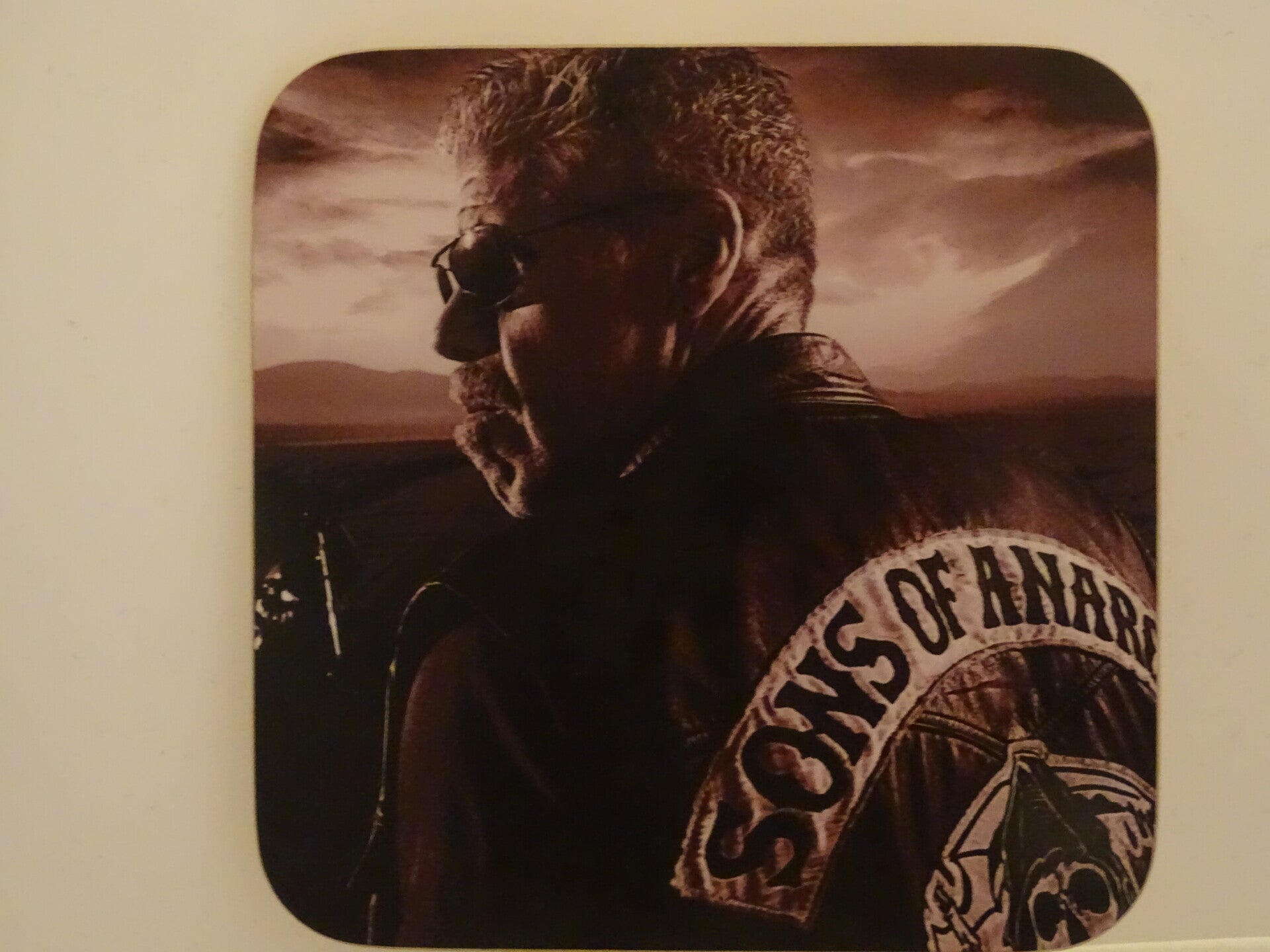 Coaster hard square Clarence 'Clay' Morrow