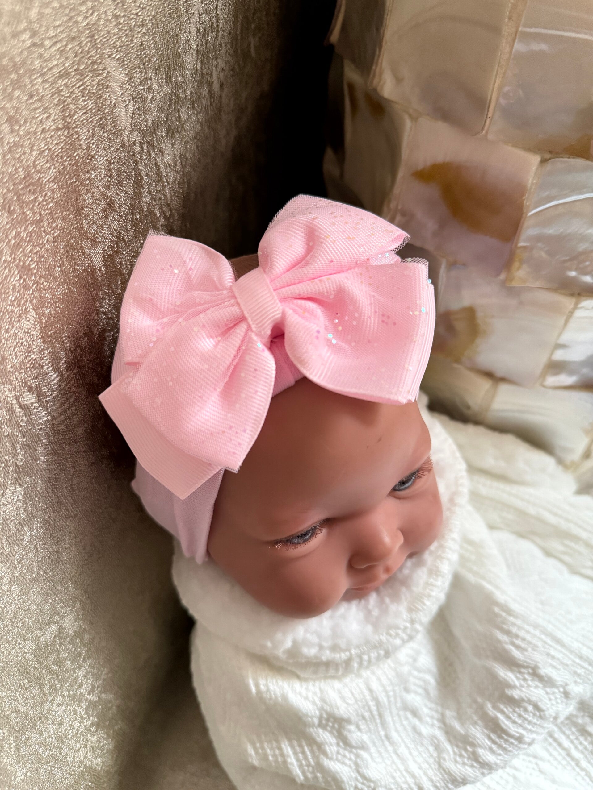 Haarband met glitter strik.