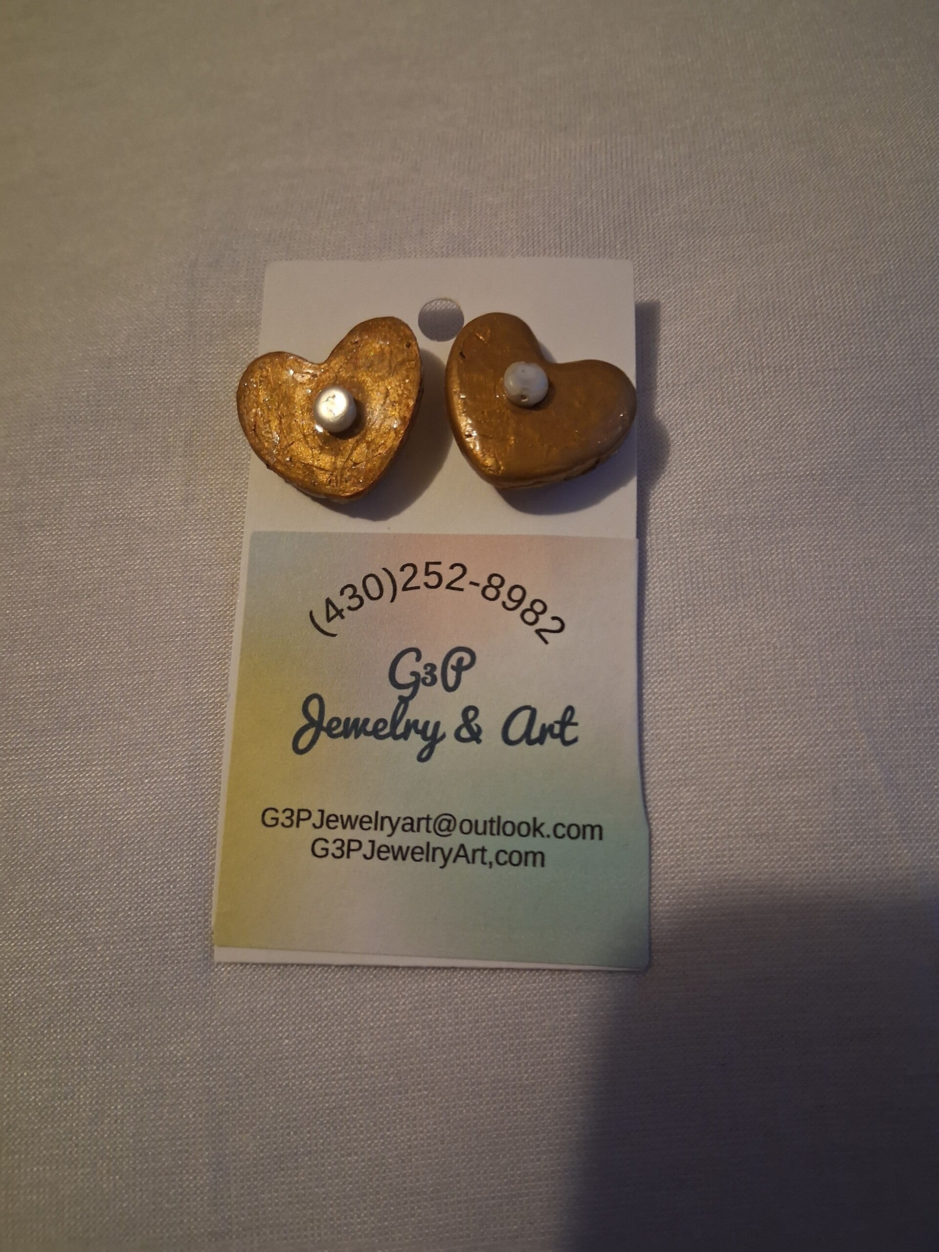 Gold & pearl heart earrings.