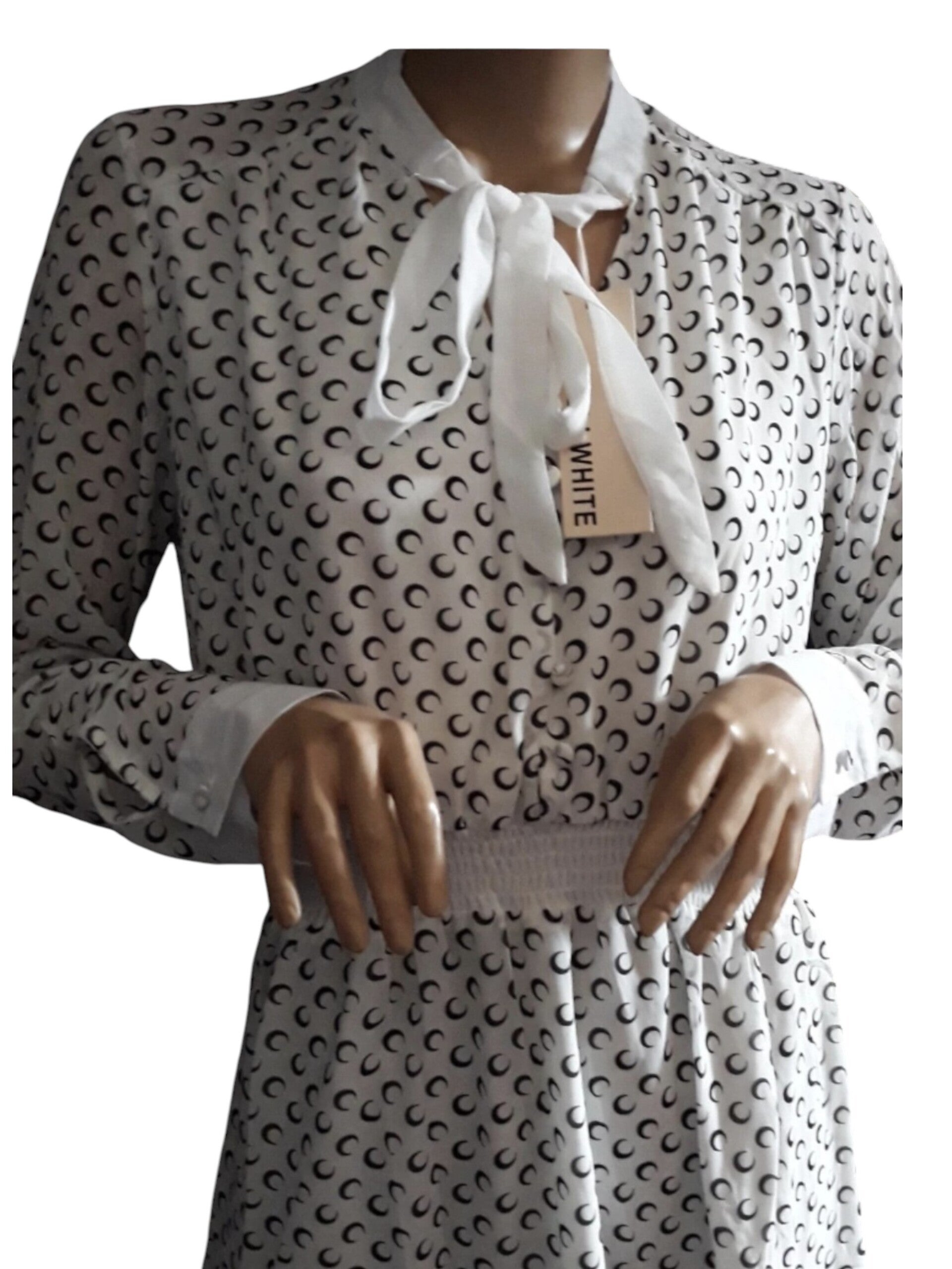 Elegante printjurk met taille-elastiek en strik