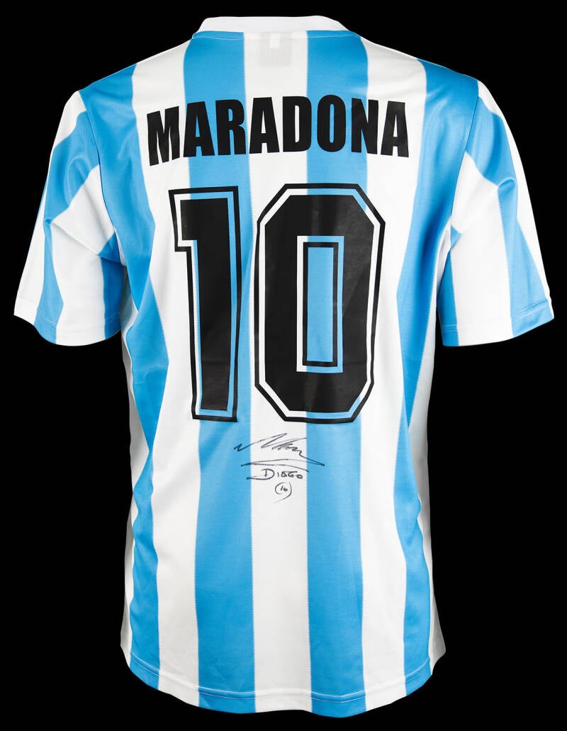Classic blue-and-white Argentina national team replica jersey by Le Cog Sportif, size large, signed on the back below his name and number in black felt tip, “Maradona, Diego, (10).”
