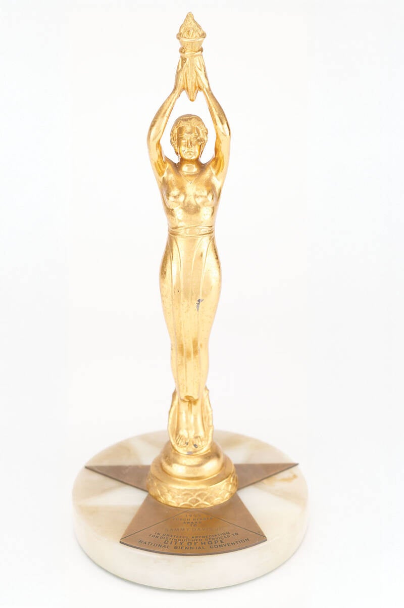 Gold-tone “1955 Torch Bearer Award” presented to Sammy Davis, Jr., at the City of Hope National Biennial Convention in 1955