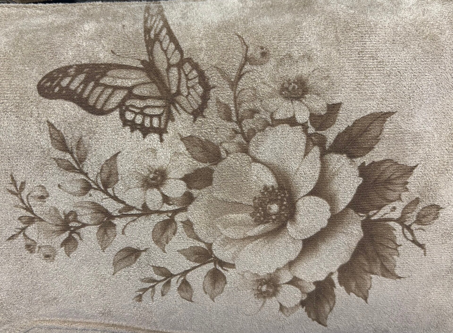 Butterfly and flowers laser etched, light beige suede style cross body bag.