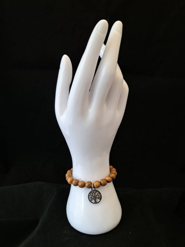 Elastische armband van wengé hout met levensboom.