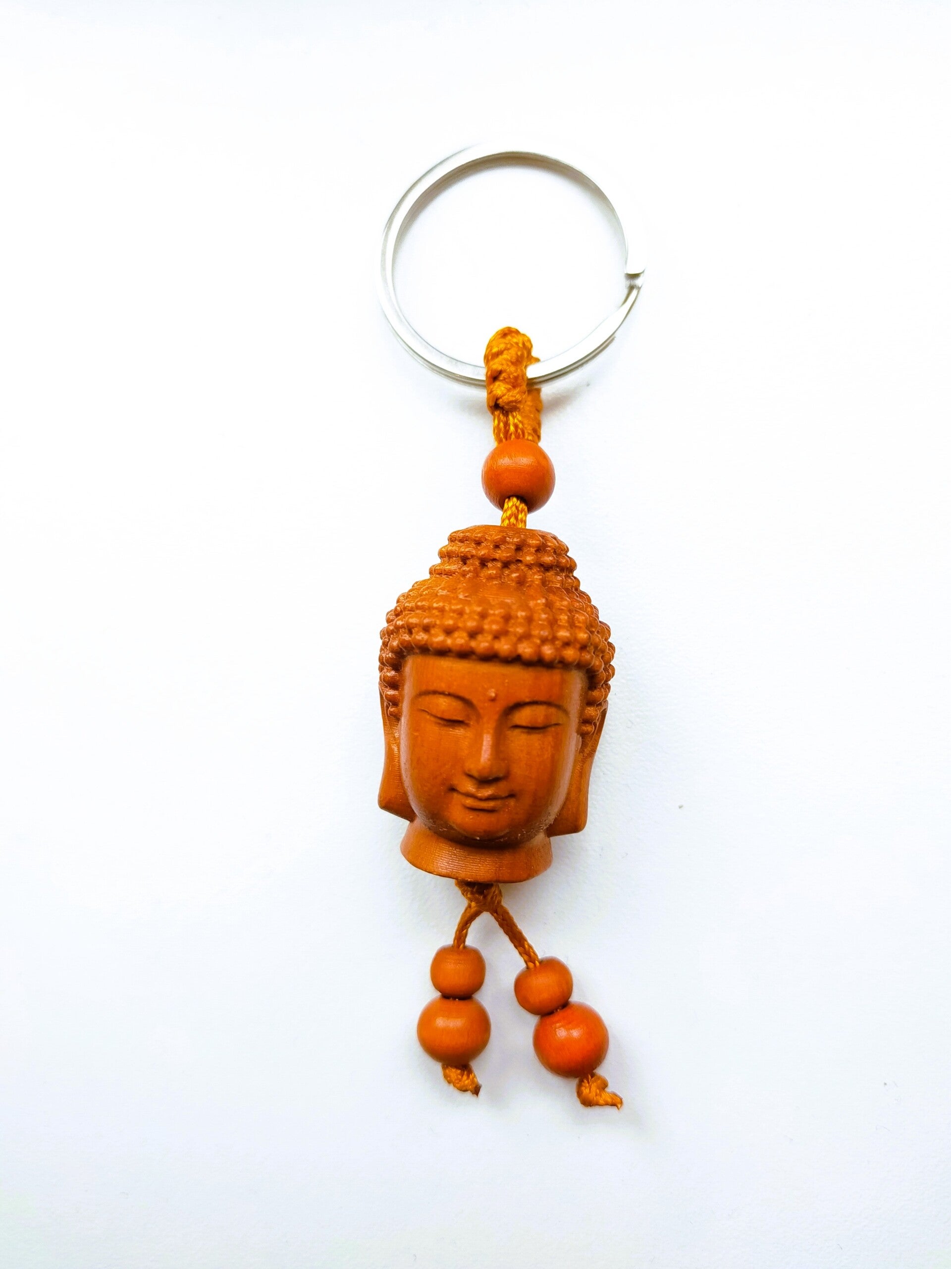 Sleutelhanger - Boeddha hoofd. (perzikhout)