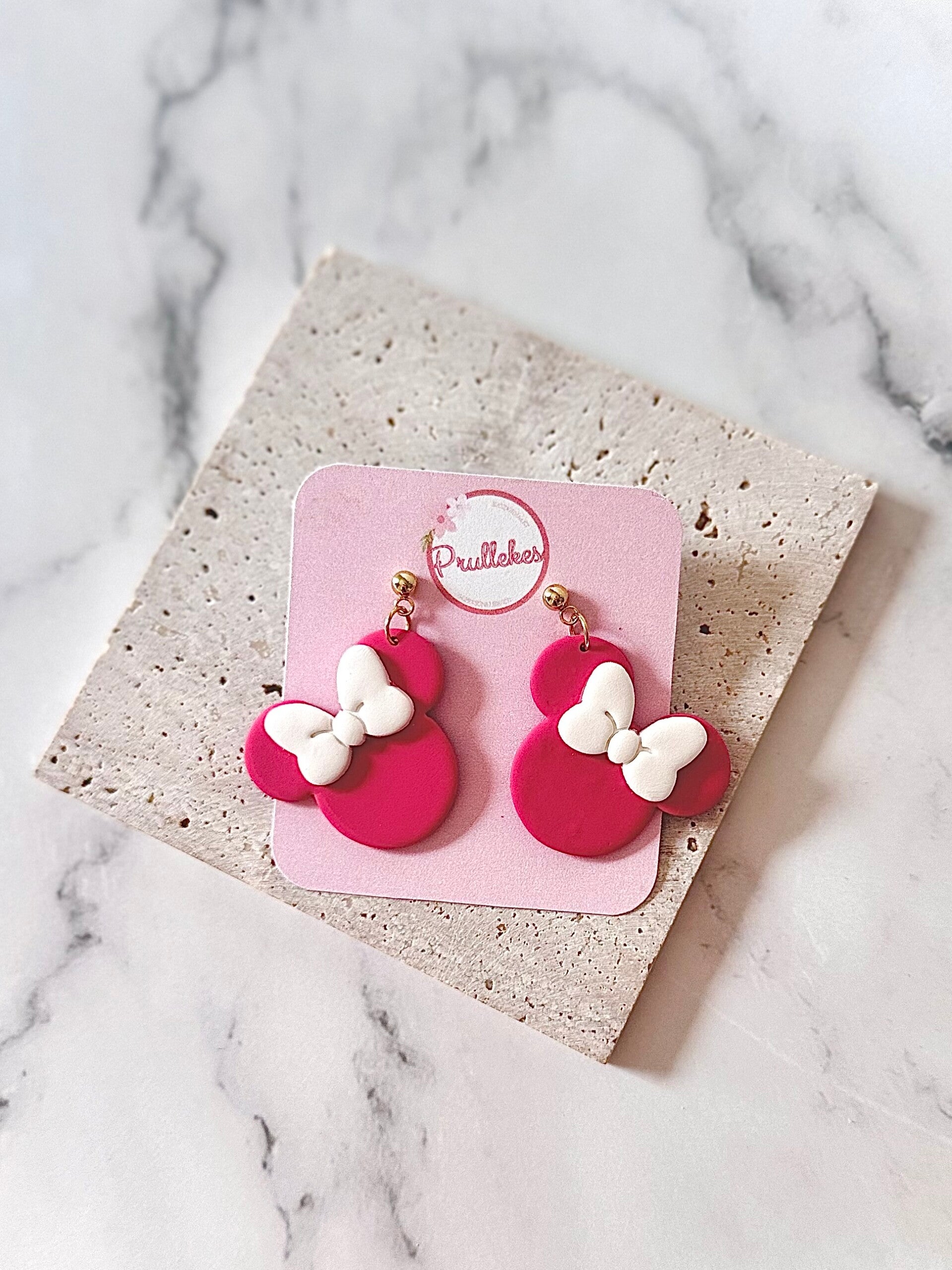 Minnie mouse donker roze + witte strik