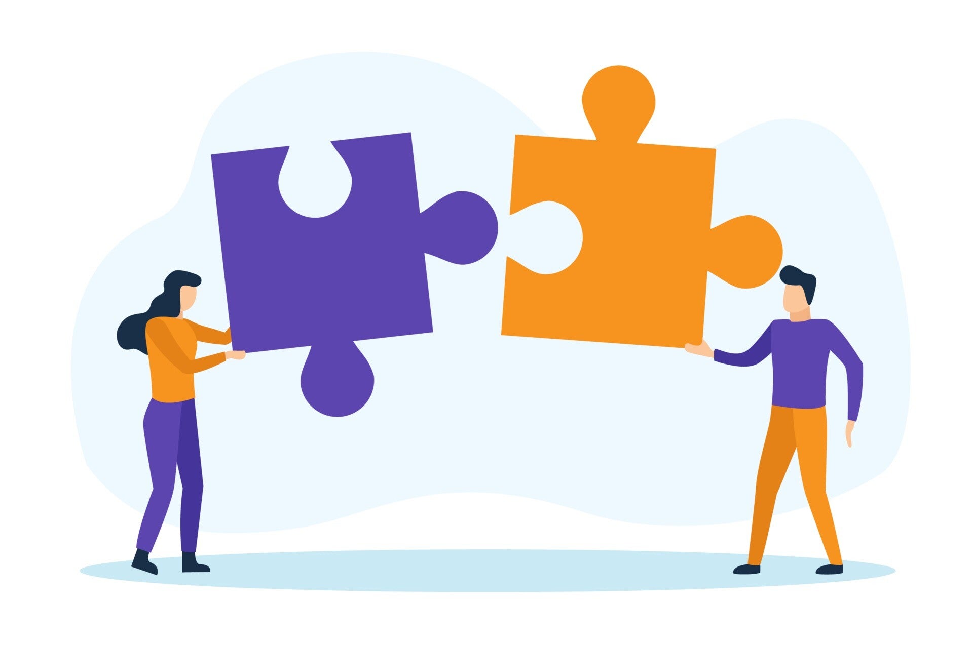 Two people fitting jigsaw pieces together, representing collaboration in CBT therapy in Wolverhampton and Telford