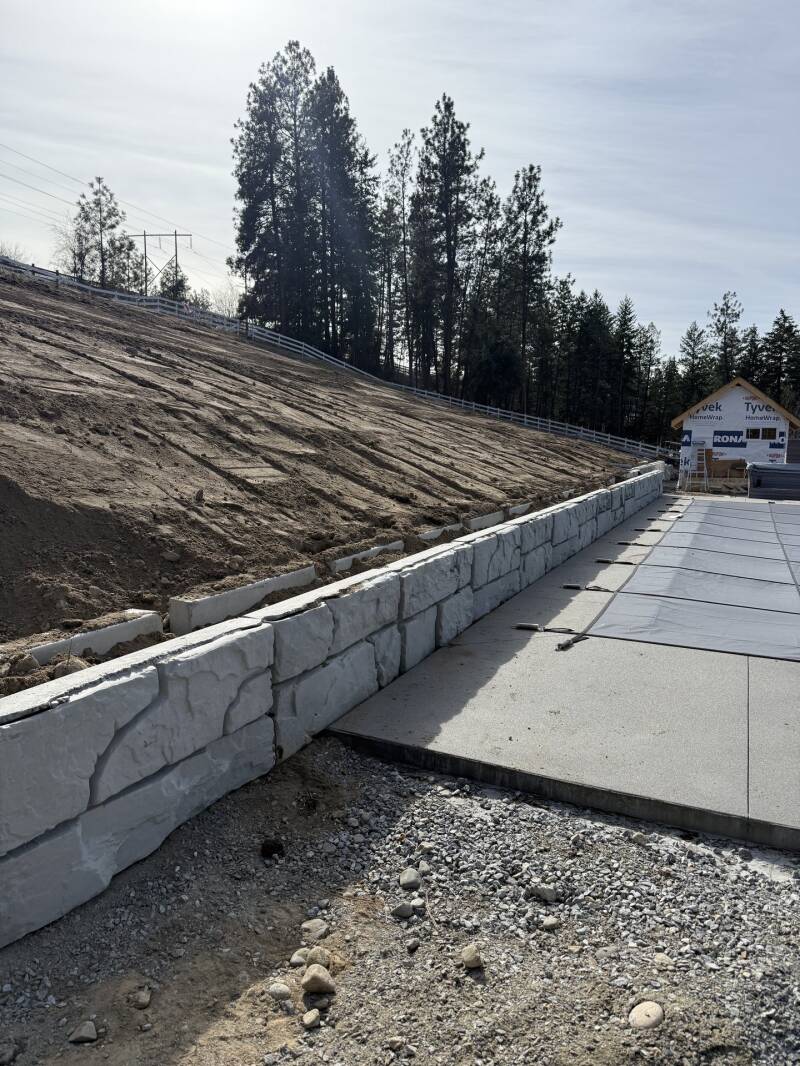 Retaining wall beside a paved path (work in progress)