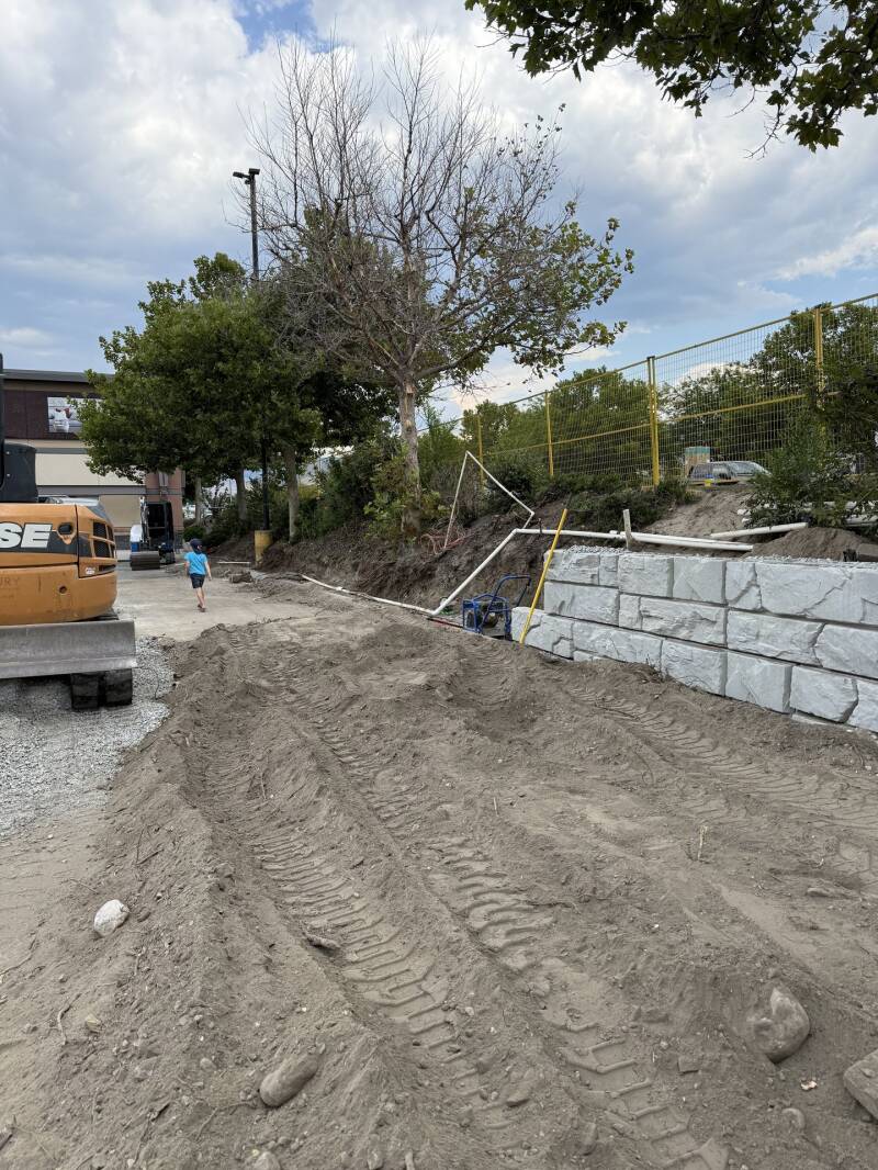 Grading beside a new retaining wall (work in progress)