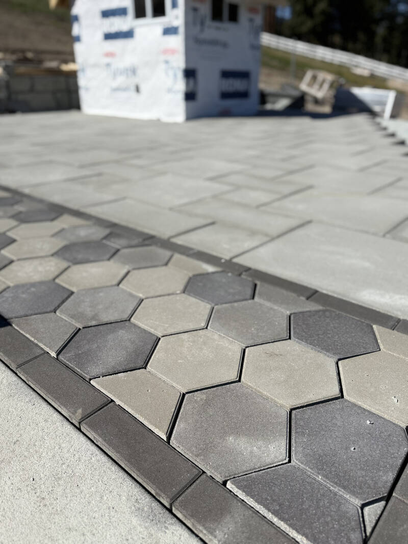 Precision transitions between hexagonal pavers and slabs