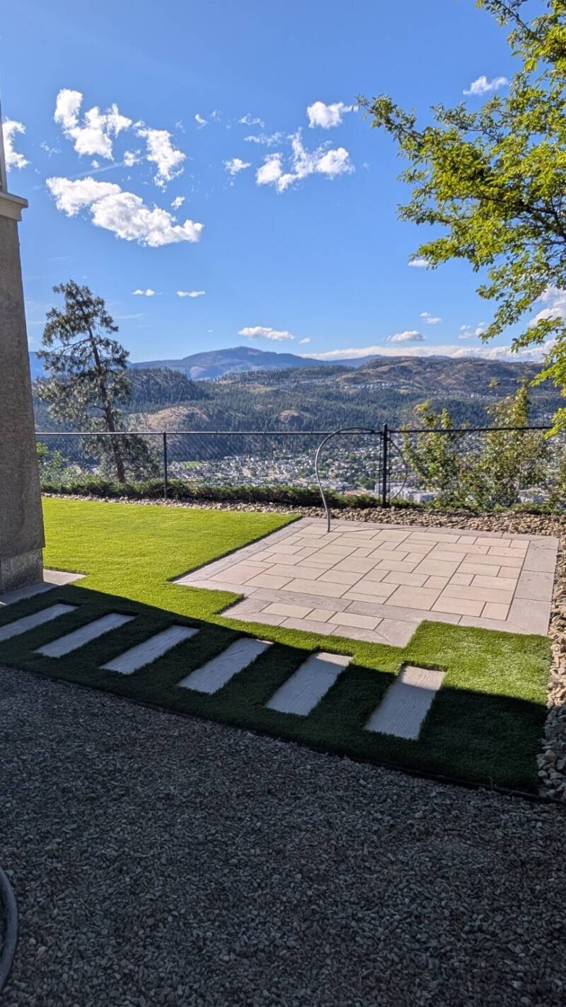 Synthetic lawn with custom paving