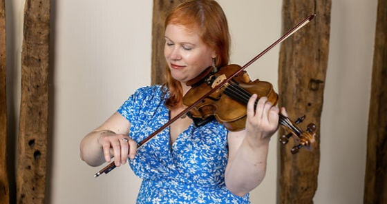 Photo of Samantha playing the violin, photo taken by Alan Lyall