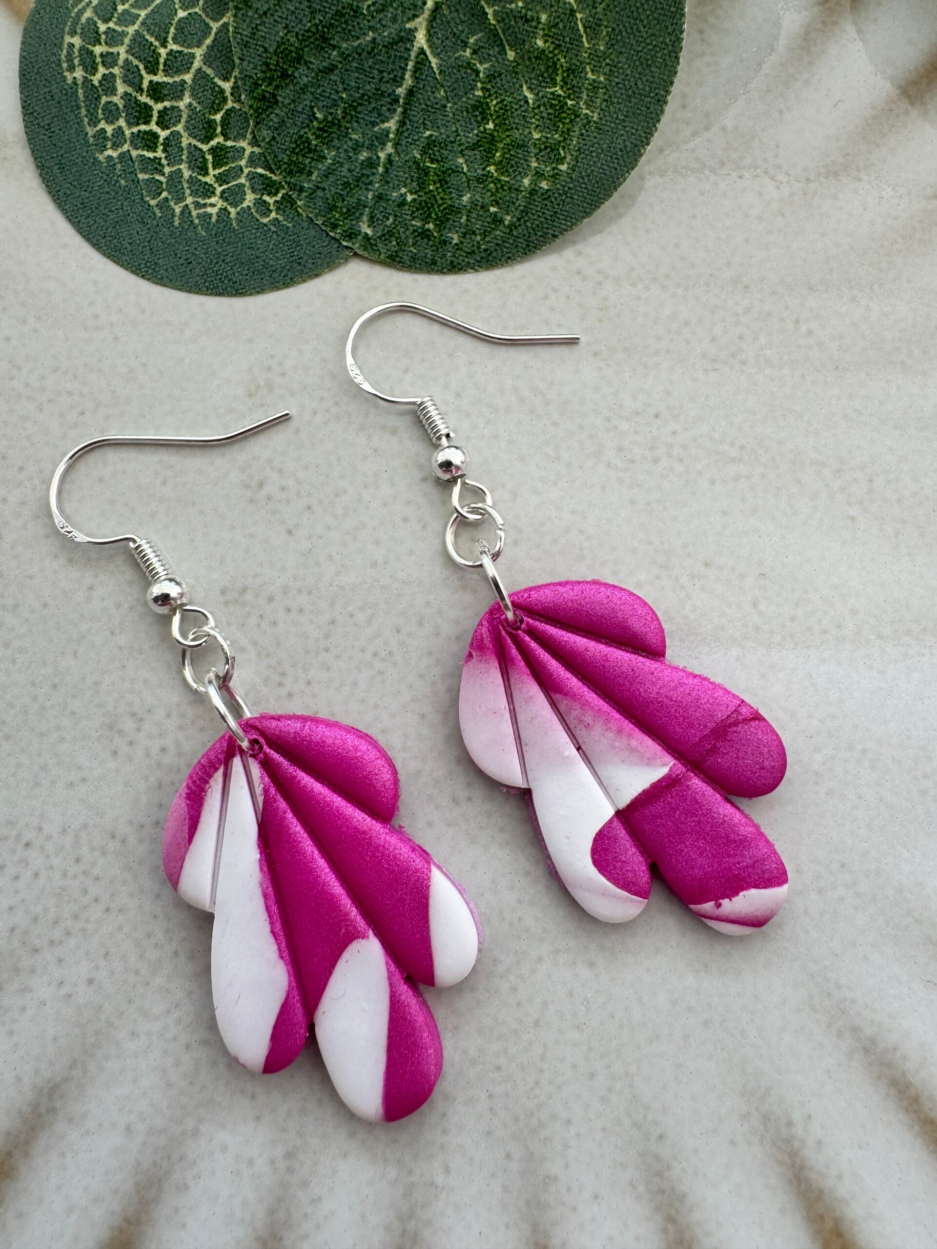 Pink and white dangle earrings