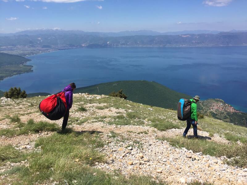 Paraglider pilots preparing
