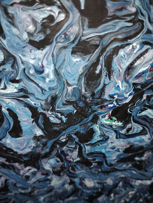 This is an abstract piece of art in canvas.  The canvas is filled with a limited palette of blue.  There are shapes of blue, inter mixed with black and white with swirls.  