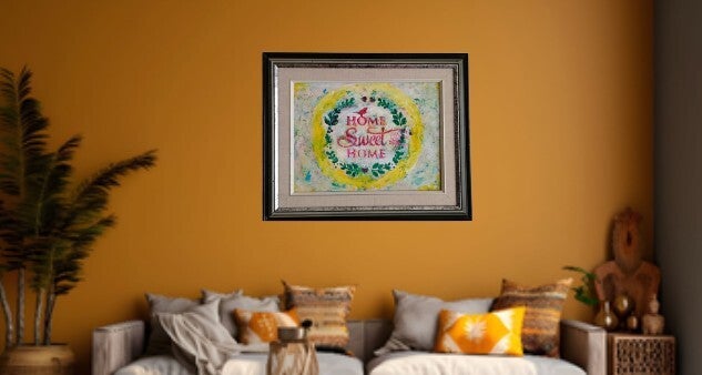 A painting with a yellow texture circle with Home zSeeet Home in the middle.