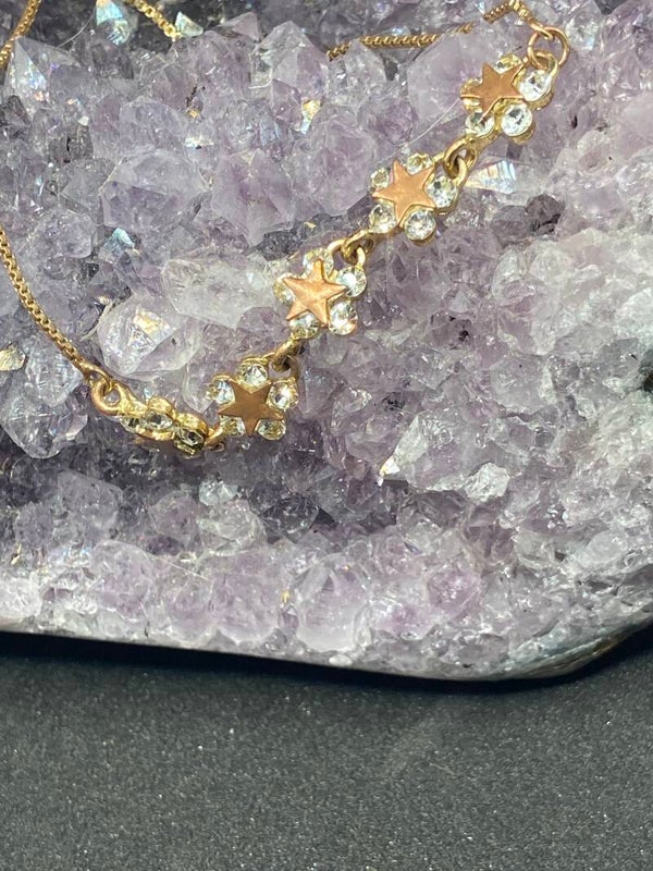 Bracelet coulissant or et fleurs étoilées zirconiums