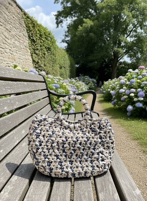 Multi coloured clutch bag.