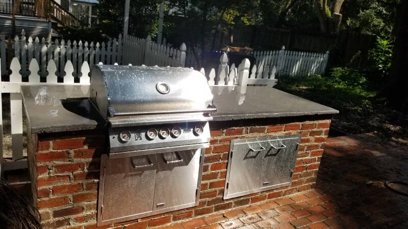 natural gas outdoor kitchen, built from reclaimed brick from on the historic property