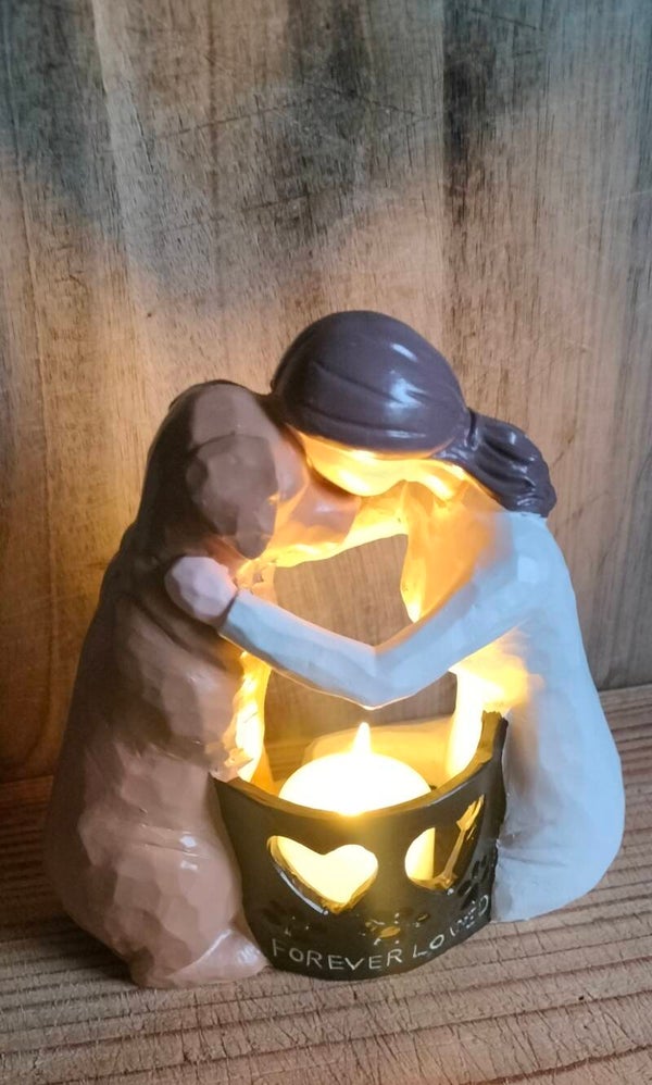 Beeldje vrouw met hond en lichtje
