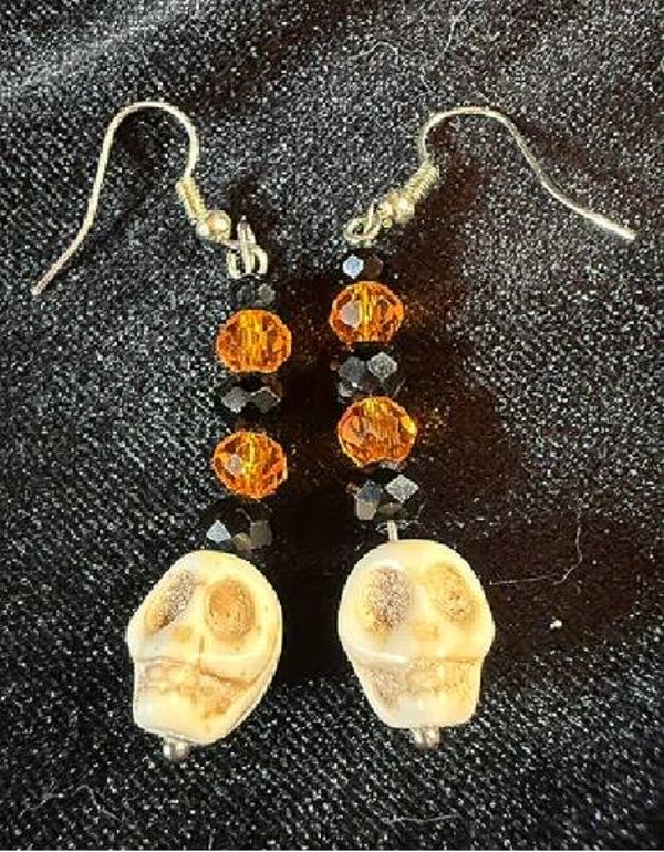 Skull with black-orange crystals earrings